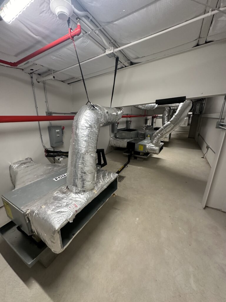 Pro-Fresh Houston air duct cleaning service technician cleaning ducts to improve commercial indoor air quality.