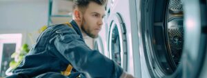 a professional technician meticulously inspects a residential dryer vent system in a bright, modern laundry room, showcasing the importance of cleanliness and safety in home maintenance.